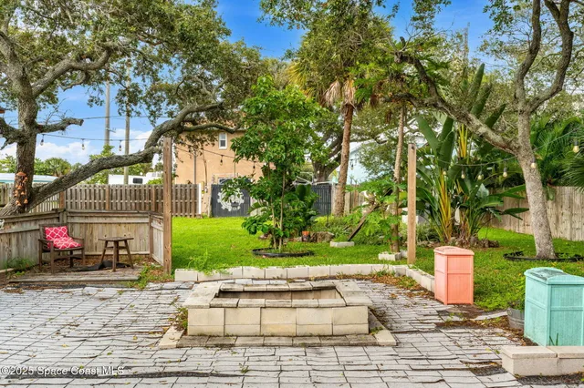a view of a backyard with a patio