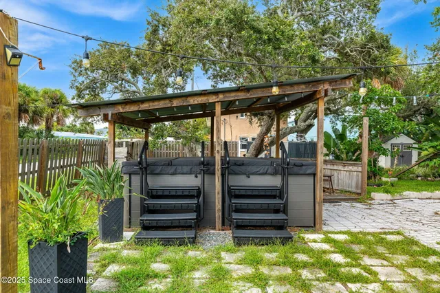 a view of a backyard with a patio