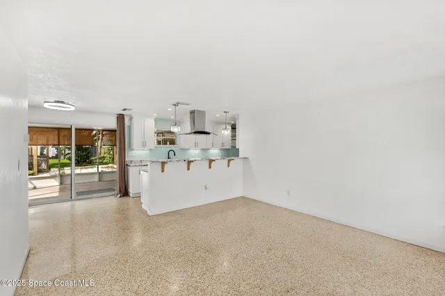 a kitchen with stainless steel appliances granite countertop a sink a stove and a granite counter tops