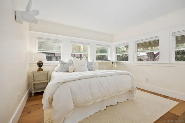 a bed room with a bed and a night stand