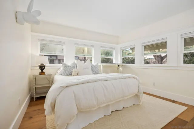 a bed room with a bed and a night stand