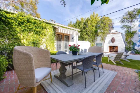 a view of a dining table and chairs in the patio