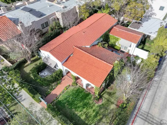 an aerial view of a house with a yard