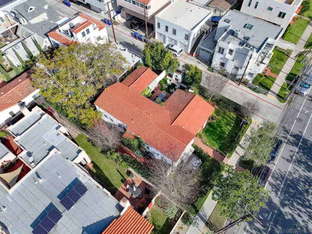 an aerial view of a house with a yard