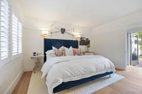 a bedroom with a bed and window