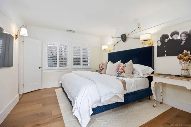 a bedroom with bed and window