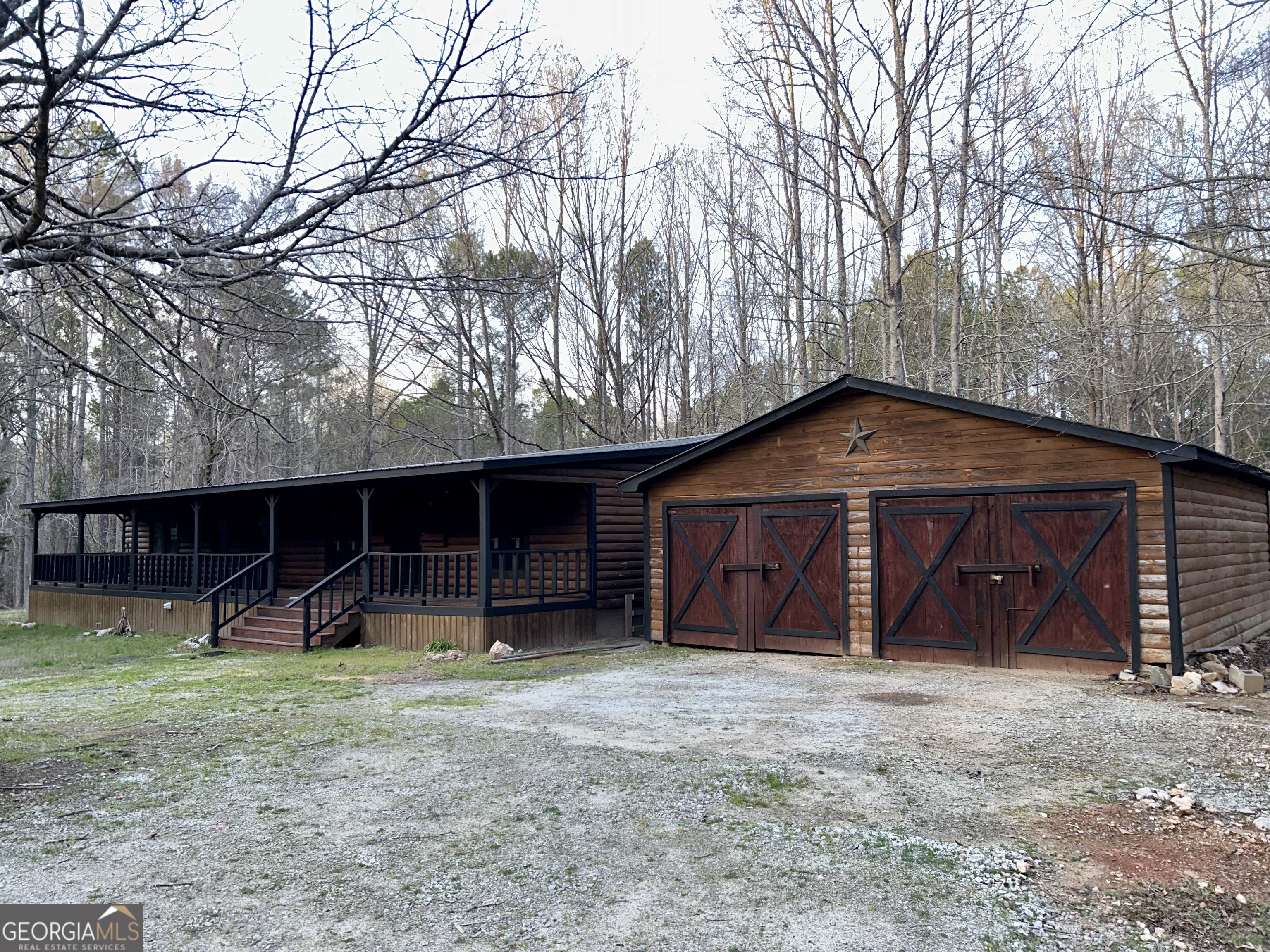 a view of a house with a yard and garage