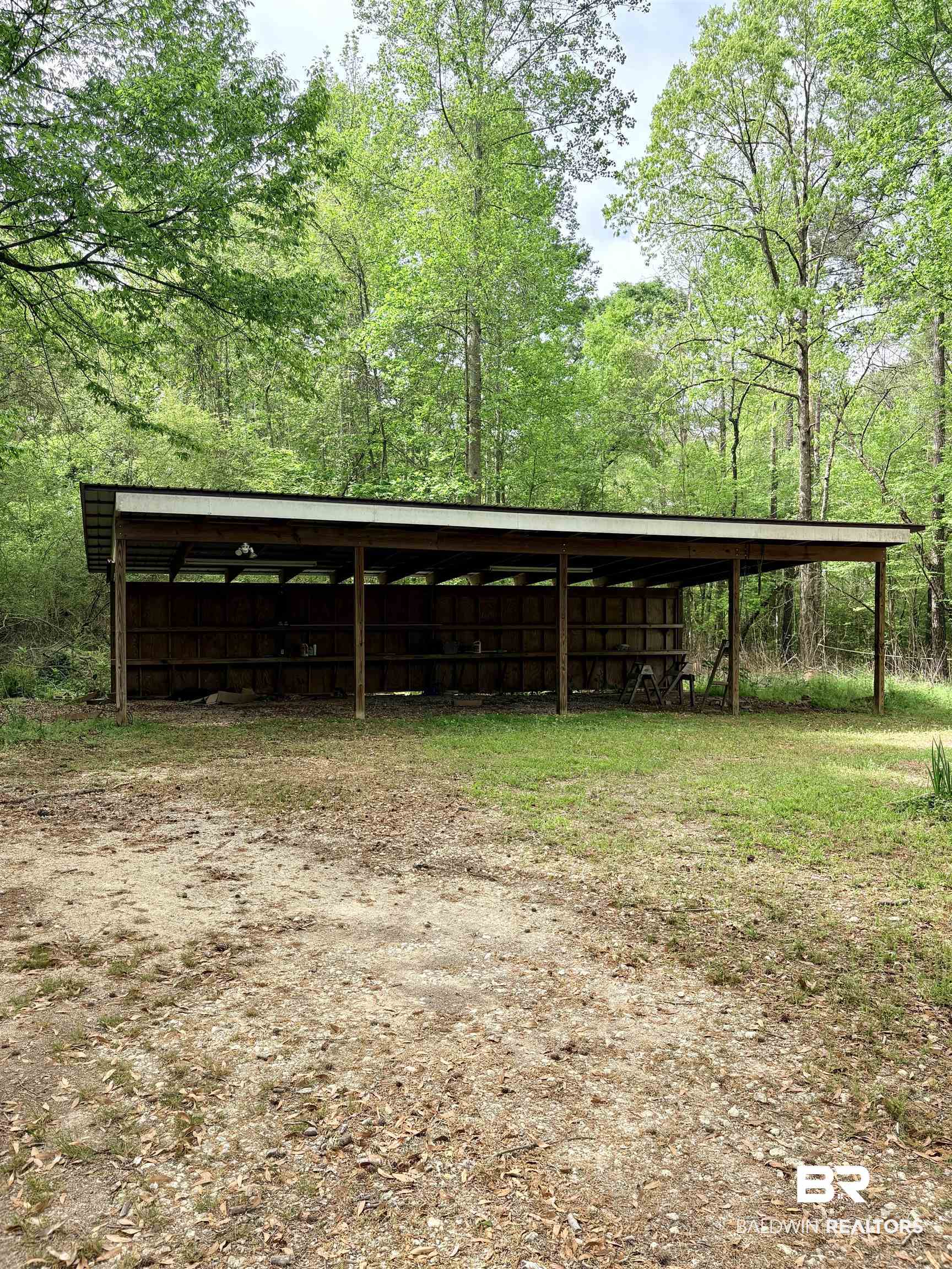 1018 Bates Road Evergreen, AL 36401 - Photo 2 of 21 View of pole building featuring a detached carport