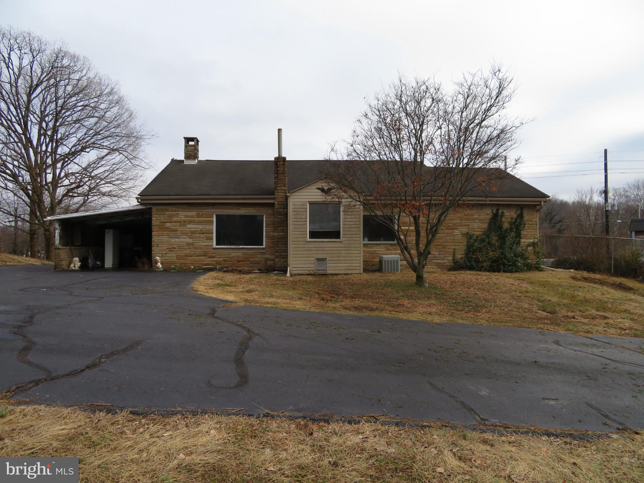 269 Crawford Quarry Road Falling Waters, WV 25419 - Photo 1 of 19 a front view of a house with garden