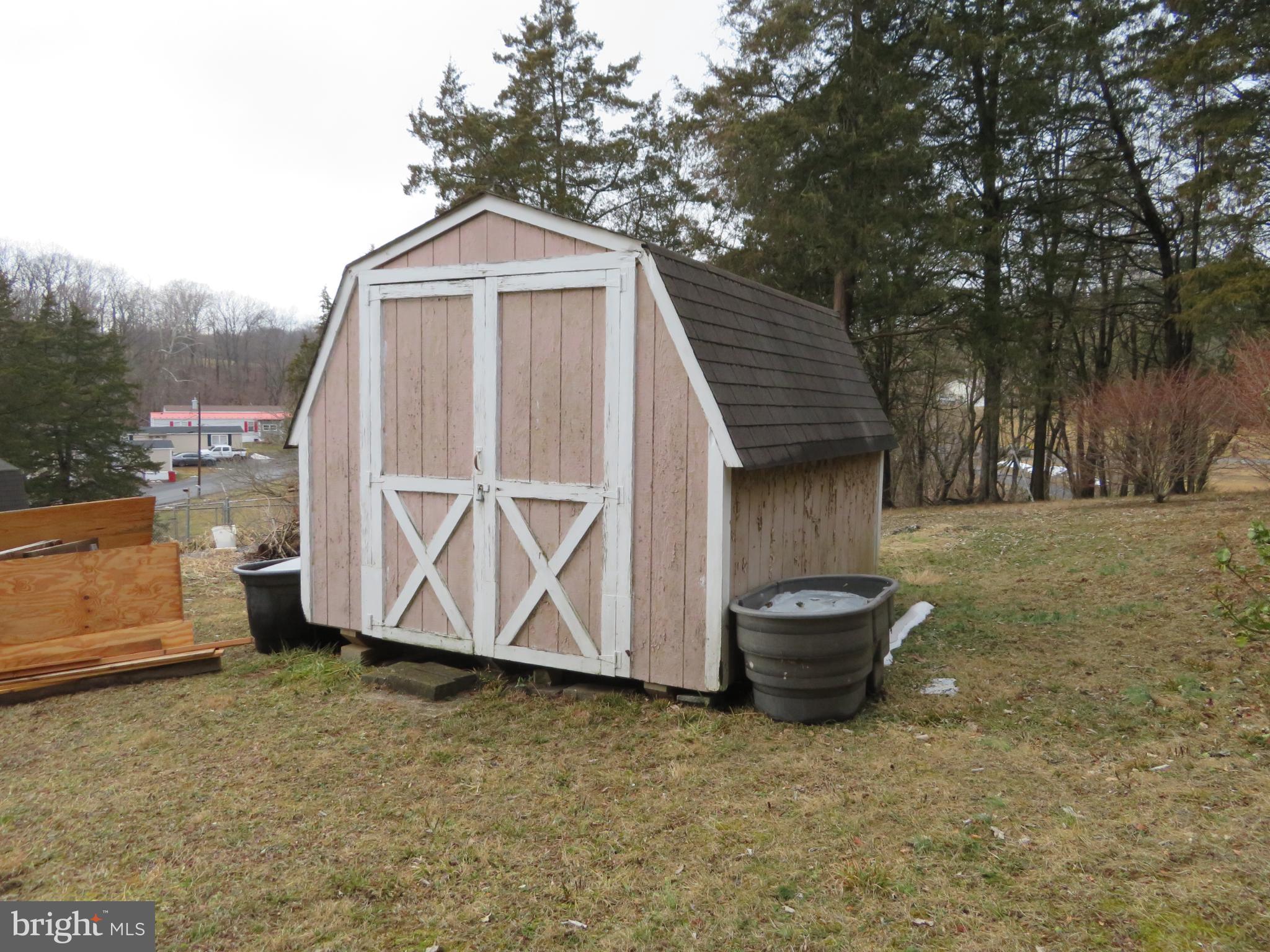 269 Crawford Quarry Road Falling Waters, WV 25419 - Photo 17 of 19 a front view of a house with a yard