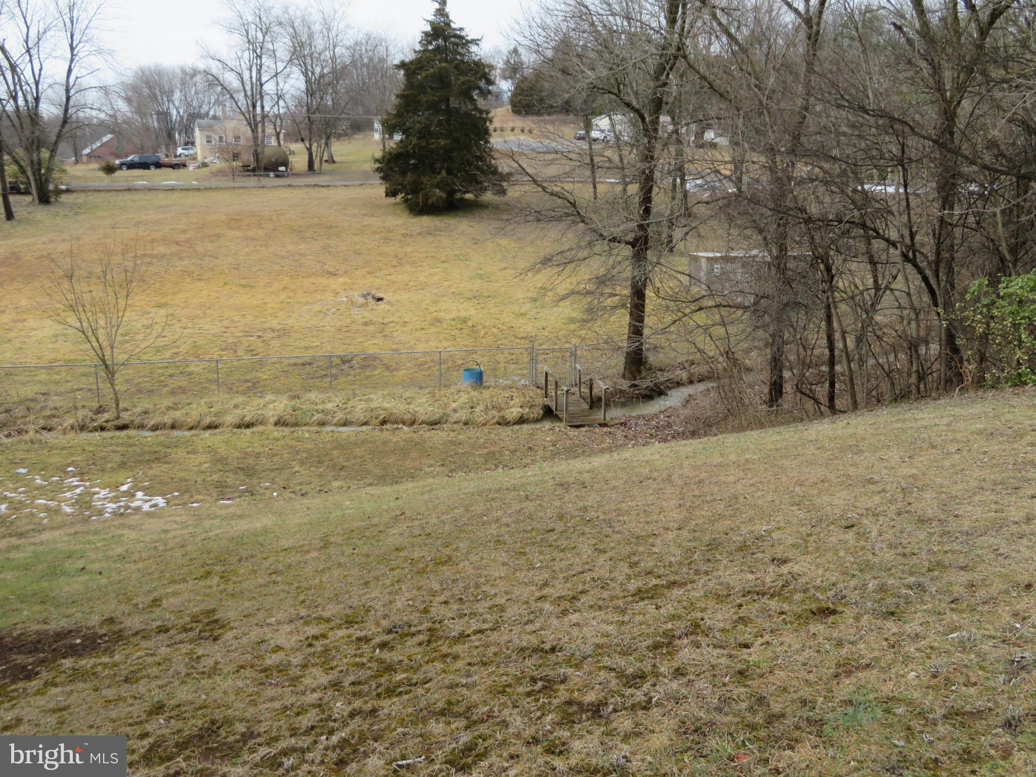 269 Crawford Quarry Road Falling Waters, WV 25419 - Photo 4 of 19 a view of a yard with snow on the road