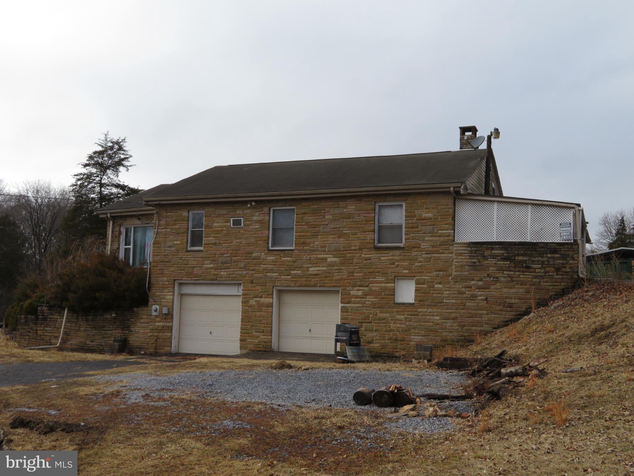 269 Crawford Quarry Road Falling Waters, WV 25419 - Photo 8 of 19 a front view of a house with a yard