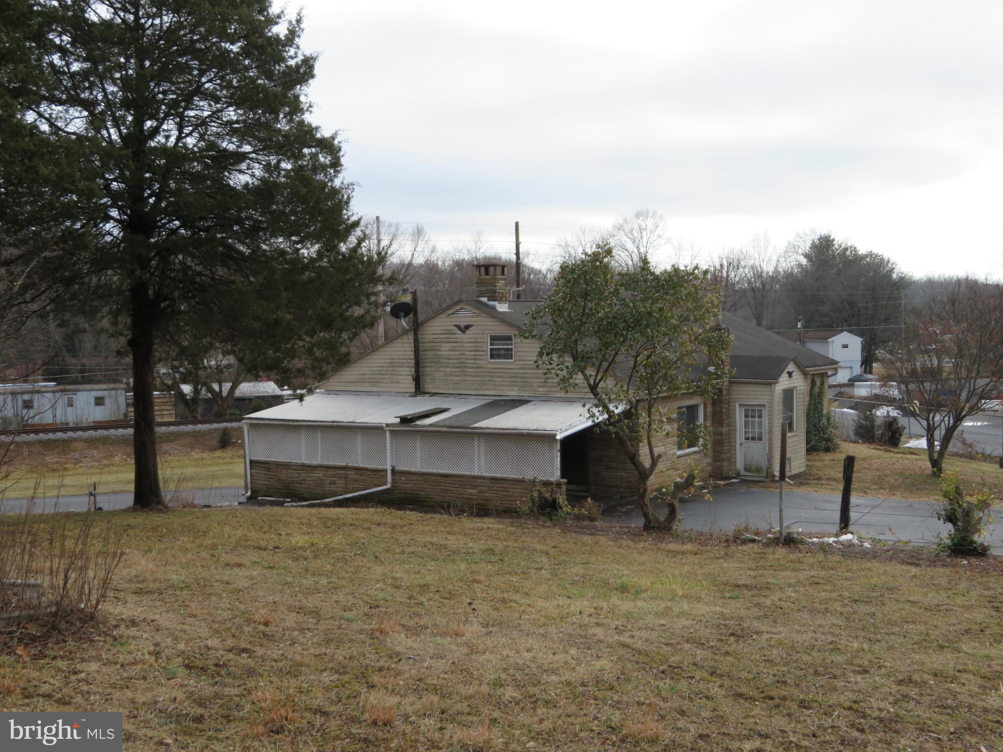 269 Crawford Quarry Road Falling Waters, WV 25419 - Photo 9 of 19 a view of a house with a yard and sitting area