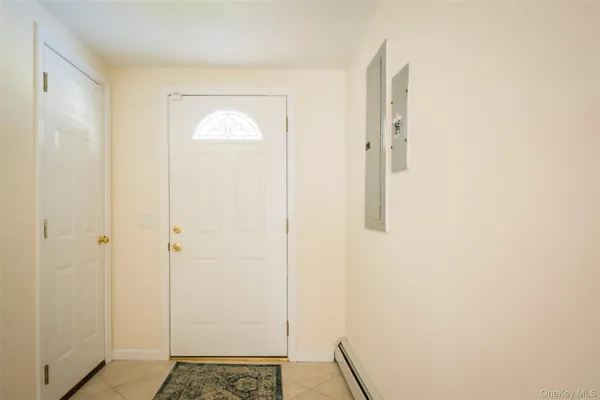 a kitchen with granite countertop a refrigerator and a sink