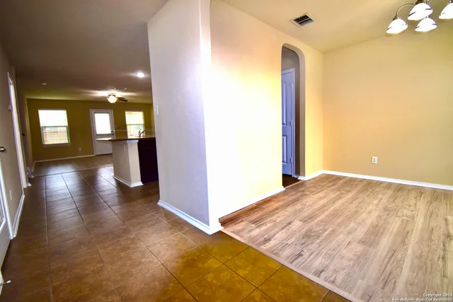 a view of a hallway view with wooden floor and staircase