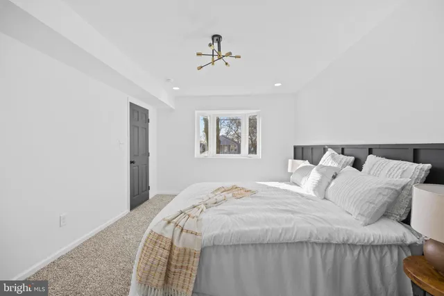 a bedroom with a bed and lamps