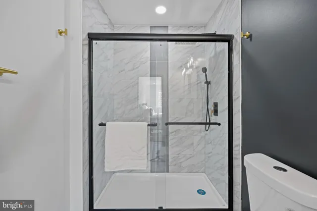 a bedroom with a bed and a table in it