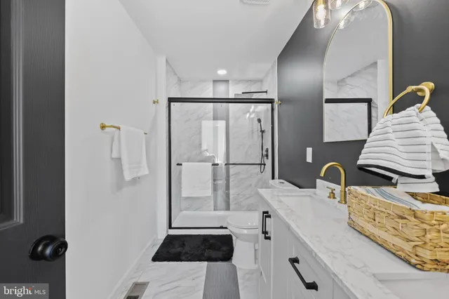 a bedroom with a bed and a night stand