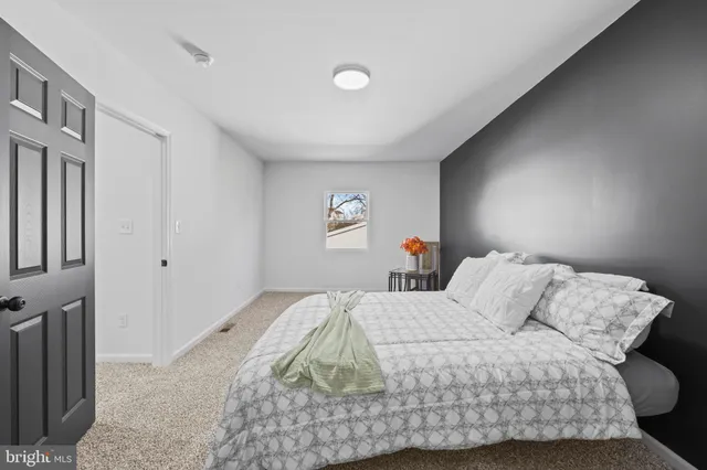 a living room with a night stand