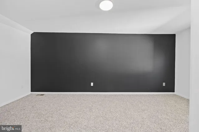 a bathroom with a toilet and a bathtub