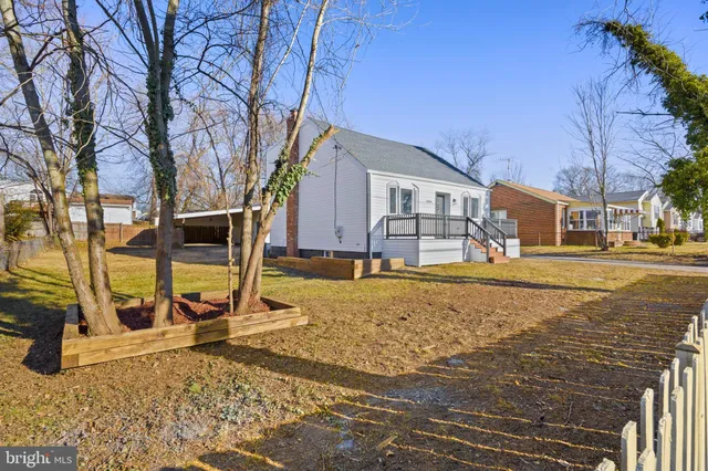a view of a house with snow on the background