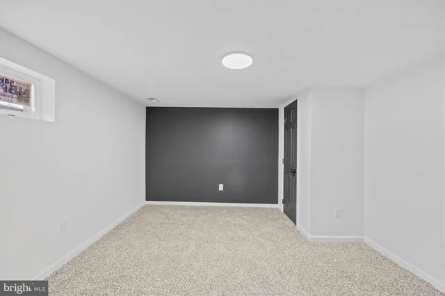 a bathroom with a toilet and a bathtub