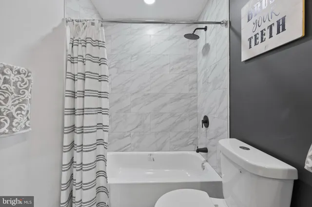 a view of a house with snow on the road