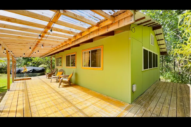 a view of a room with a big yard