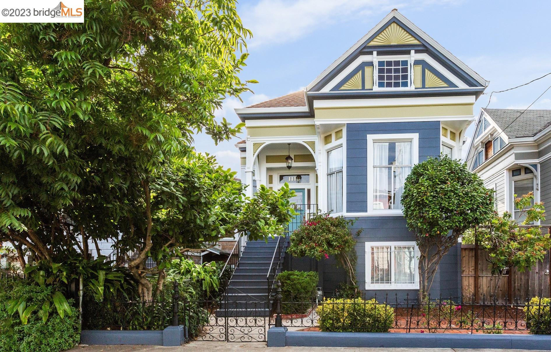 a front view of a house with plants