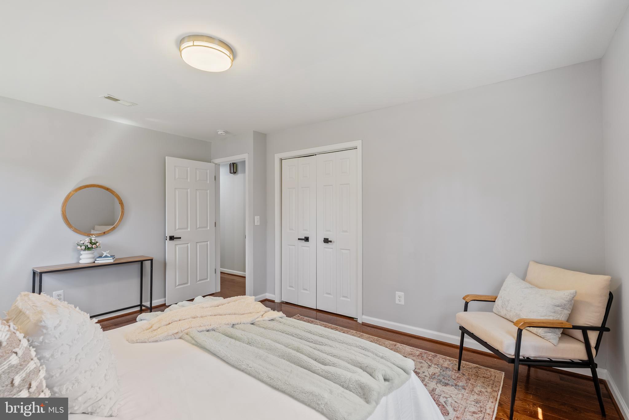 10021 Fox Den Road Ellicott City, MD 21042 - Photo 16 of 41 a bedroom with a bed and chair