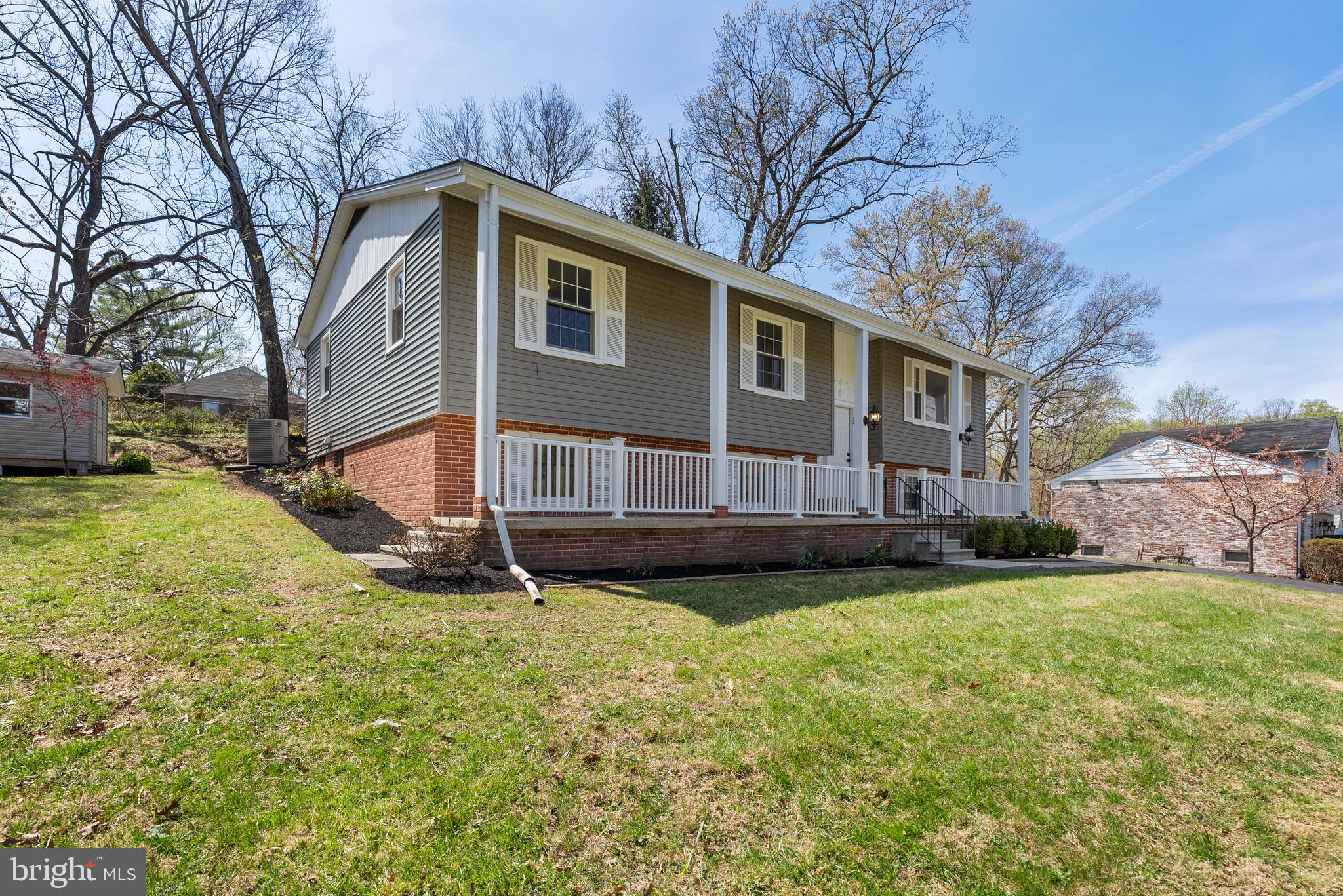 10021 Fox Den Road Ellicott City, MD 21042 - Photo 31 of 41 a view of a house with a yard