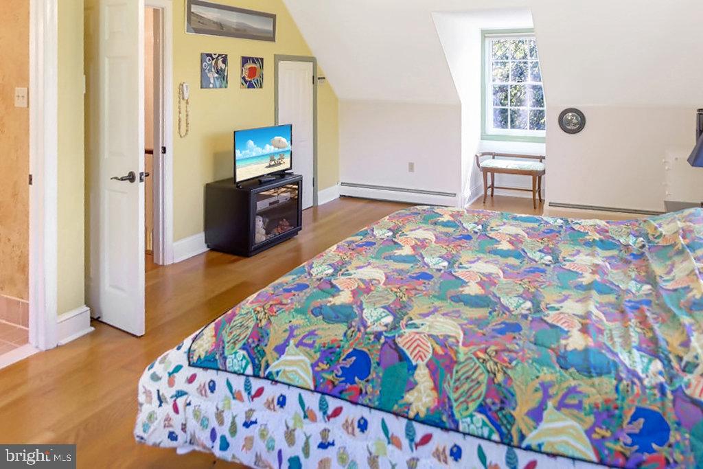 1609 Walton Road Blue Bell, PA 19422 - Photo 26 of 64 a bedroom with a bed and painting on the wall