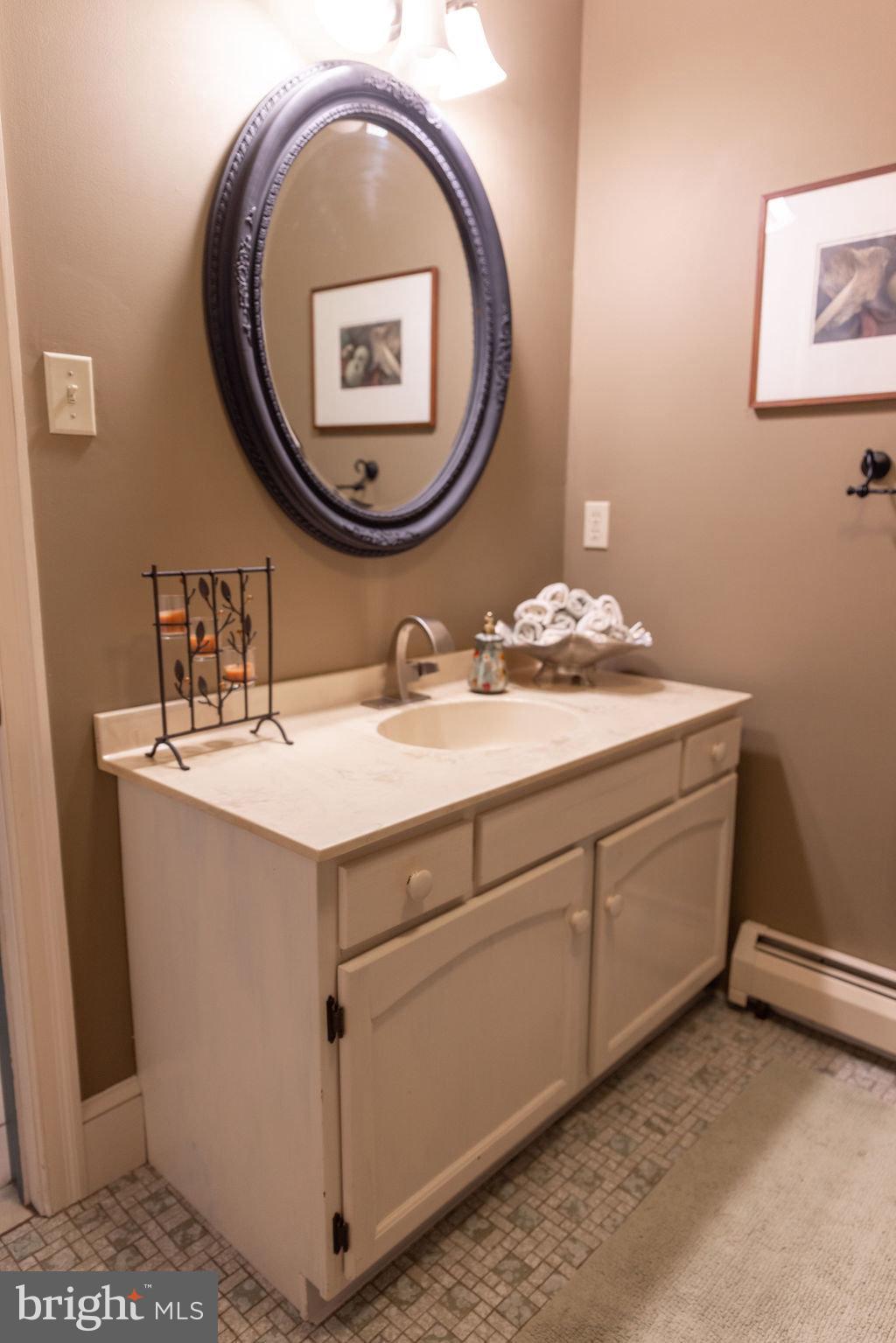 1609 Walton Road Blue Bell, PA 19422 - Photo 35 of 64 a bathroom with a sink and a mirror