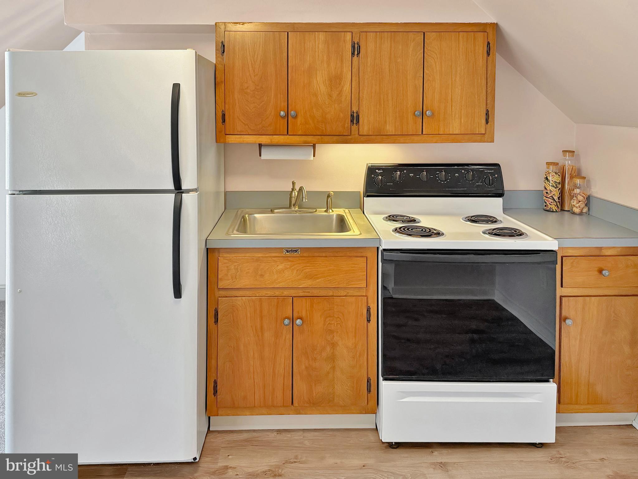 1609 Walton Road Blue Bell, PA 19422 - Photo 39 of 64 a kitchen with a refrigerator sink and cabinets