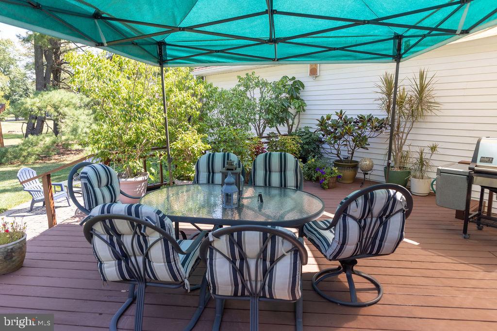 1609 Walton Road Blue Bell, PA 19422 - Photo 56 of 64 a view of a patio with table and chairs under an umbrella
