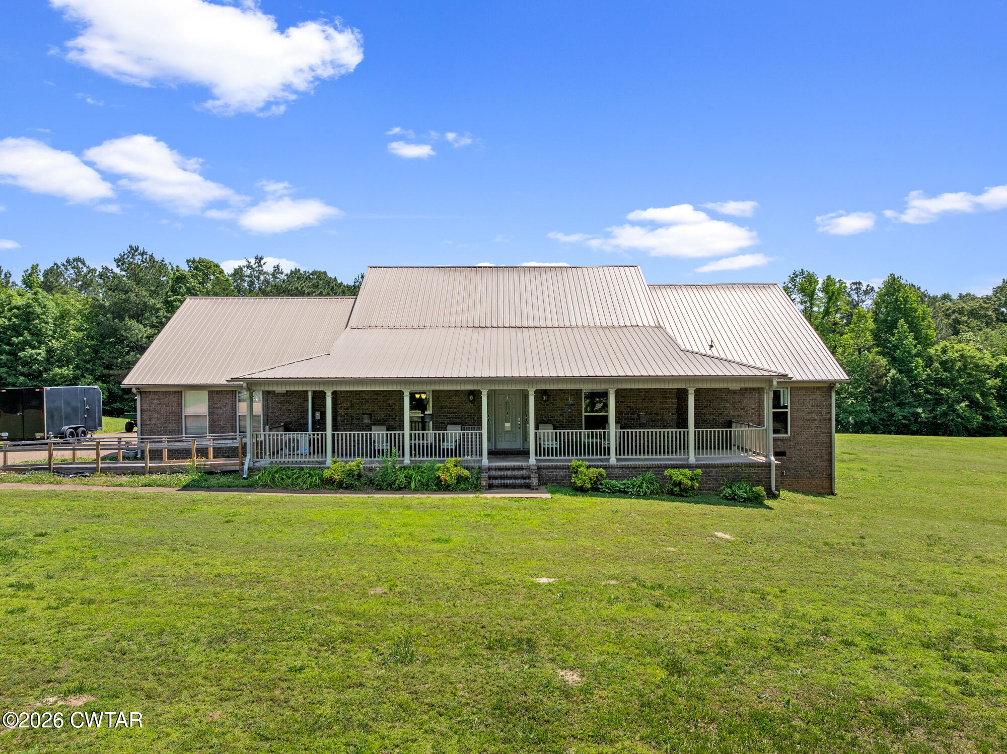 492 Joe Horton Road Lexington, TN 38351 - Photo 4 of 49 a view of a house with a garden and yard