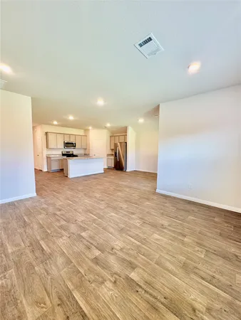 a view of a kitchen with a sink and a stove top oven