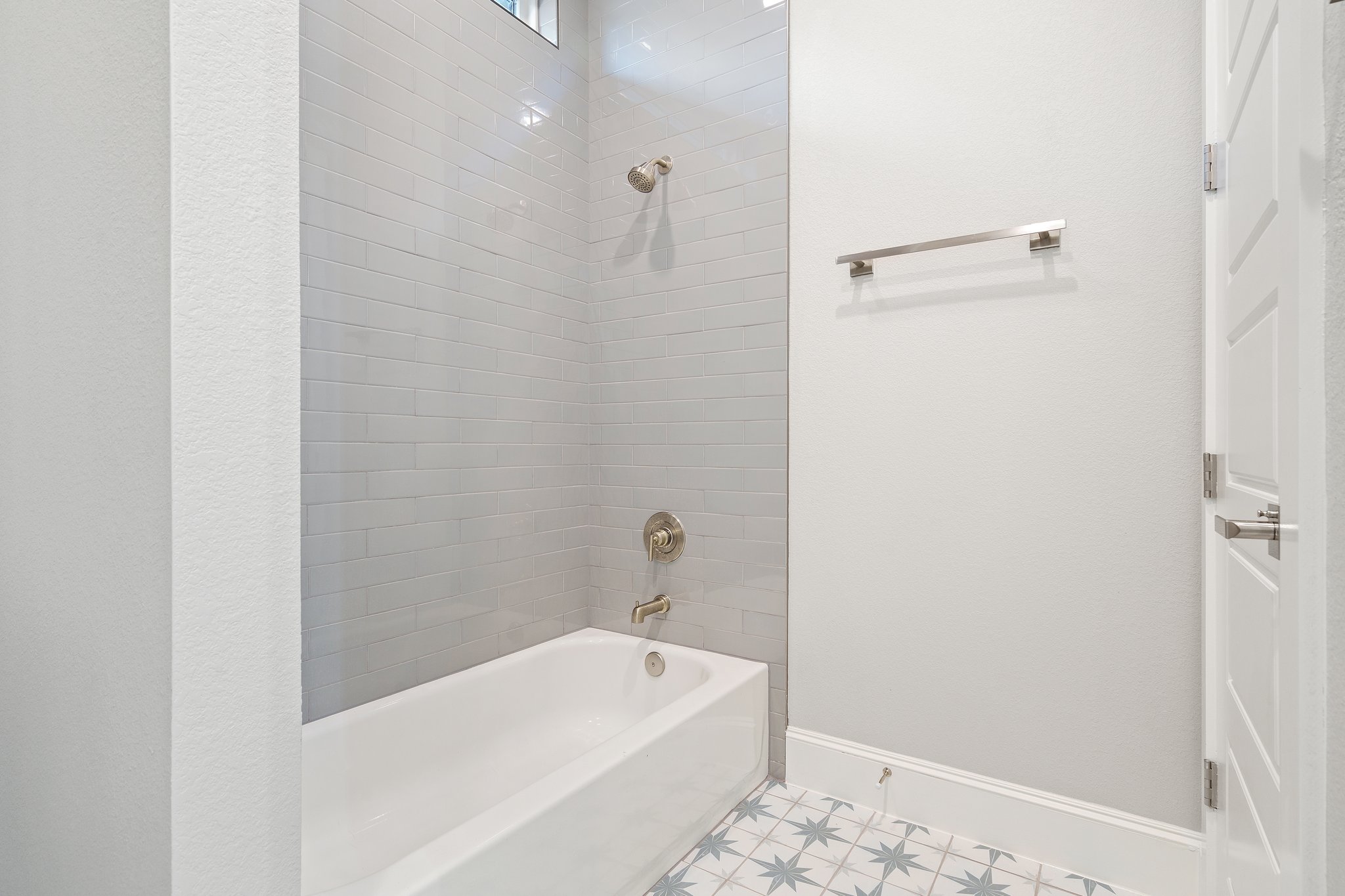 112 Axis Loop Georgetown, TX 78628 - Photo 31 of 39 a bathroom with a bathtub and shower