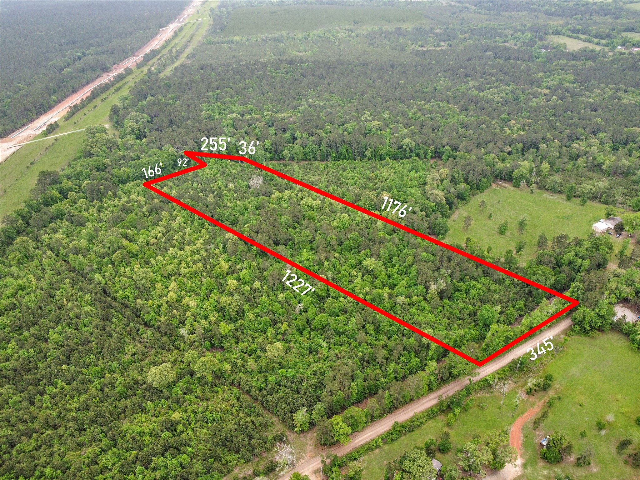 0 Raven Hill Road Oakhurst, TX 77359 - Photo 5 of 9 a view of a lush green field
