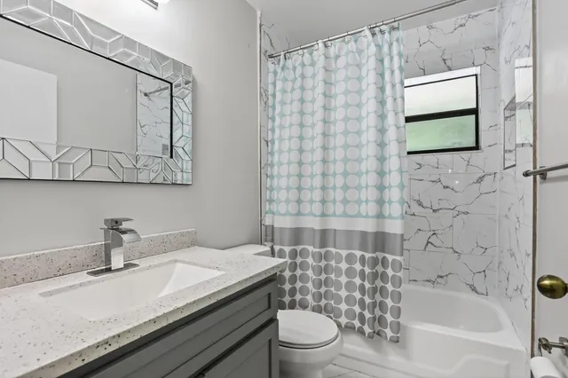 a bathroom with a sink and mirror