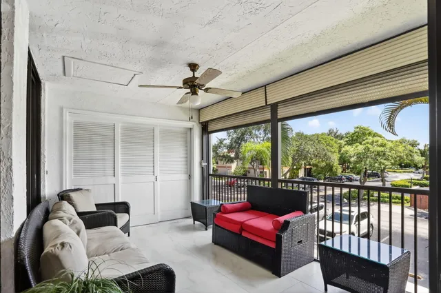 a view of a house with a small yard and plants