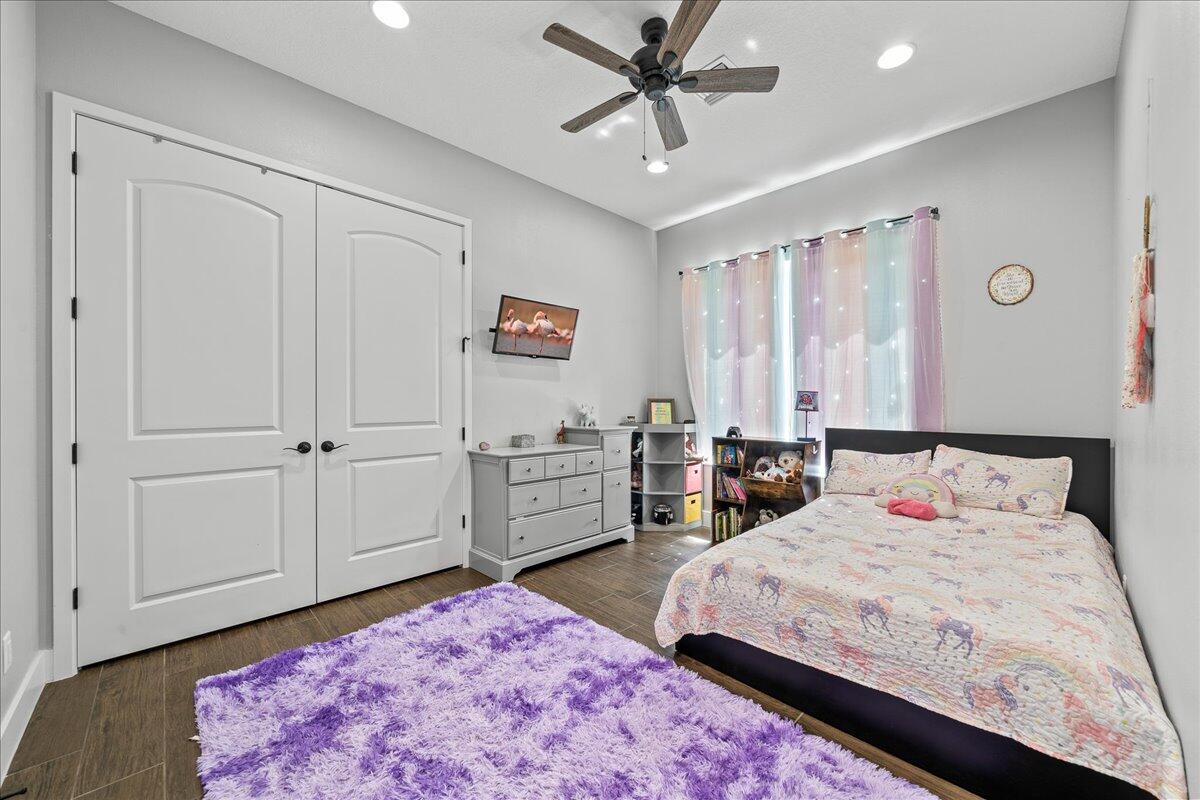 3490 Grant Line Road Mims, FL 32754 - Photo 20 of 43 a bedroom with a bed and a dresser