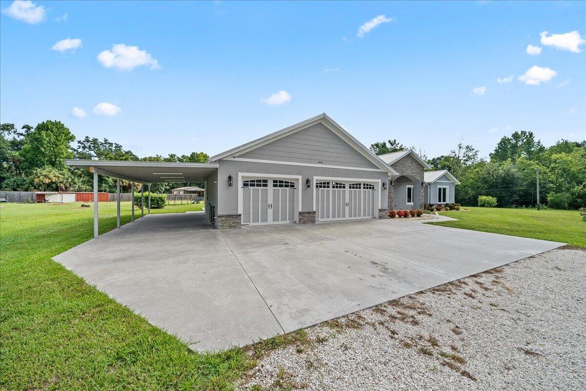 3490 Grant Line Road Mims, FL 32754 - Photo 23 of 43 a view of house with outdoor space and swimming pool