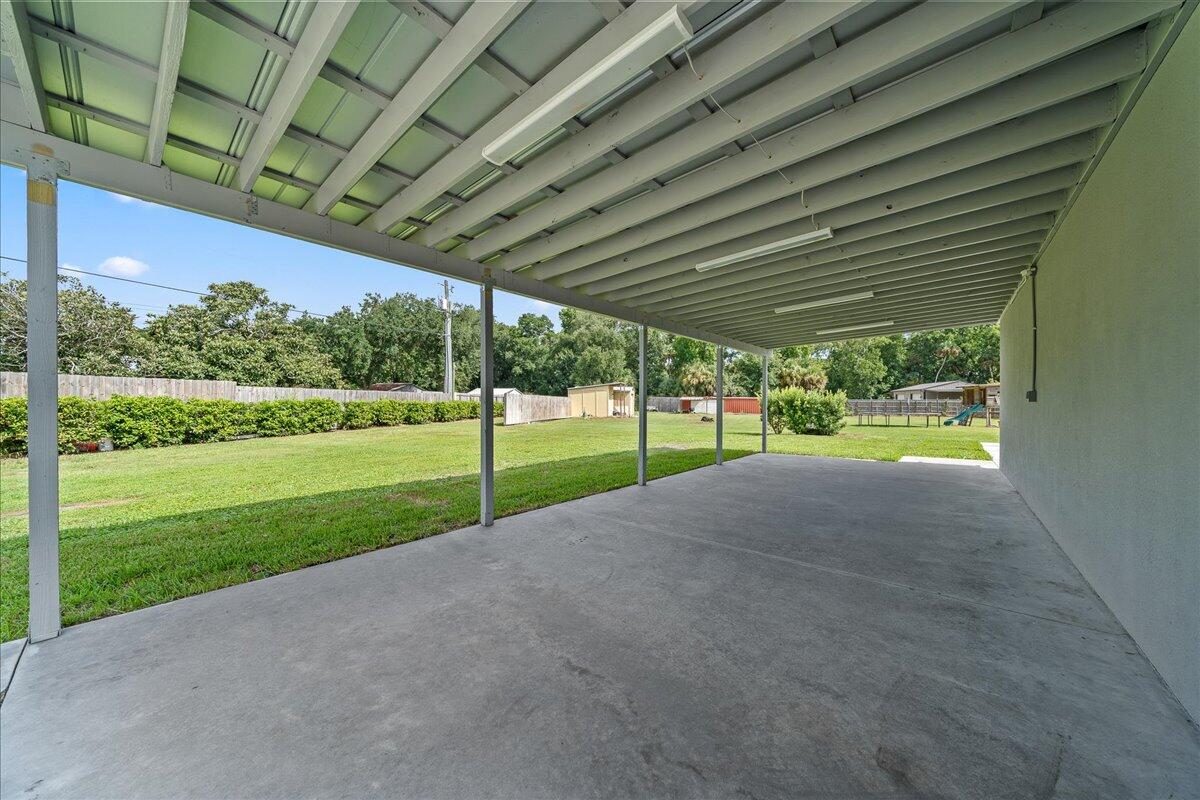 3490 Grant Line Road Mims, FL 32754 - Photo 24 of 43 a view of a house with backyard and porch