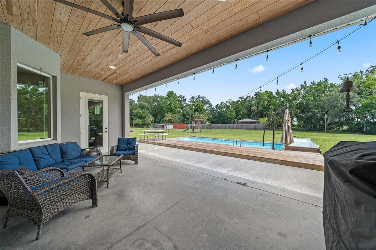 3490 Grant Line Road Mims, FL 32754 - Photo 28 of 43 a living room with furniture and a large window