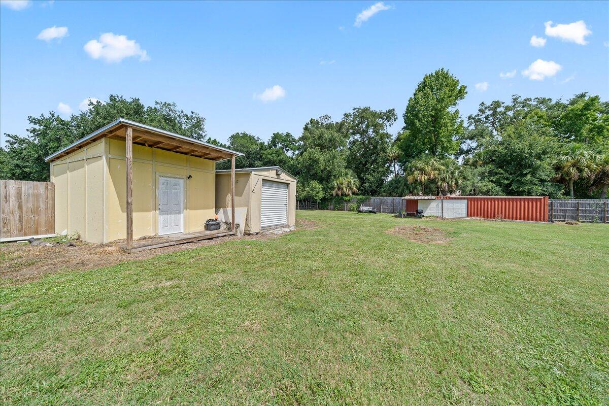 3490 Grant Line Road Mims, FL 32754 - Photo 29 of 43 a backyard of a house with lots of green space