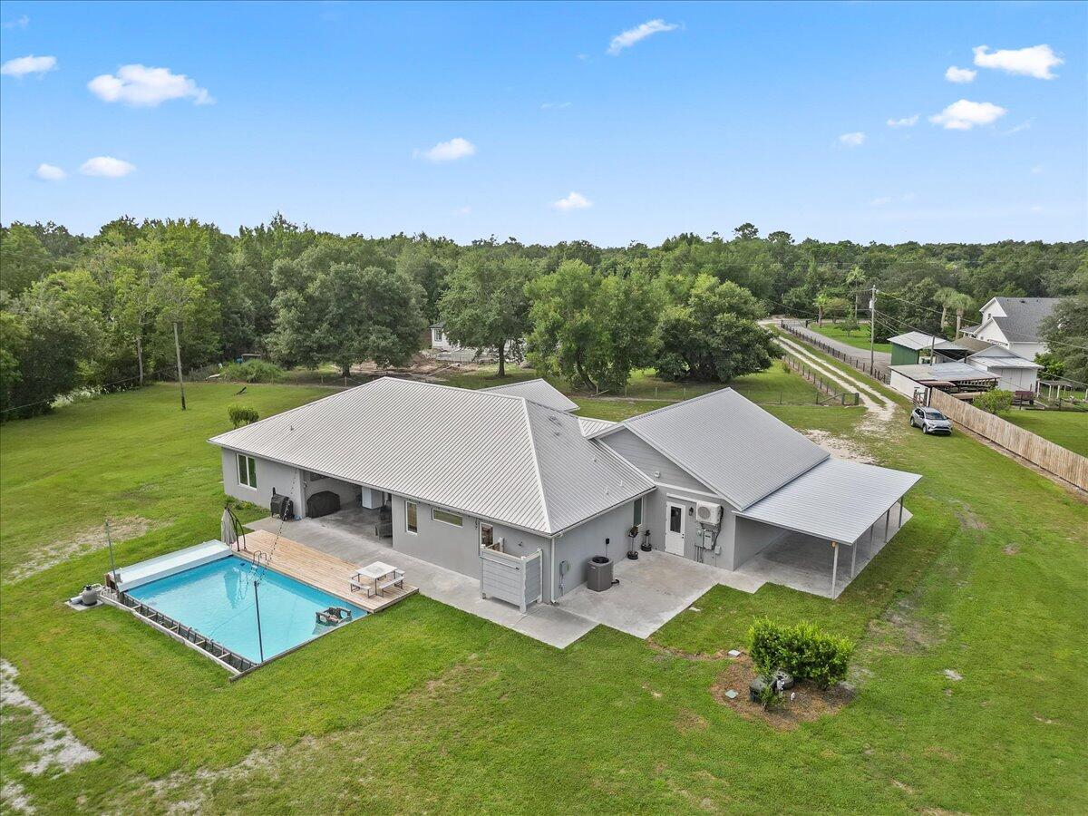 3490 Grant Line Road Mims, FL 32754 - Photo 33 of 43 an aerial view of a house with a garden