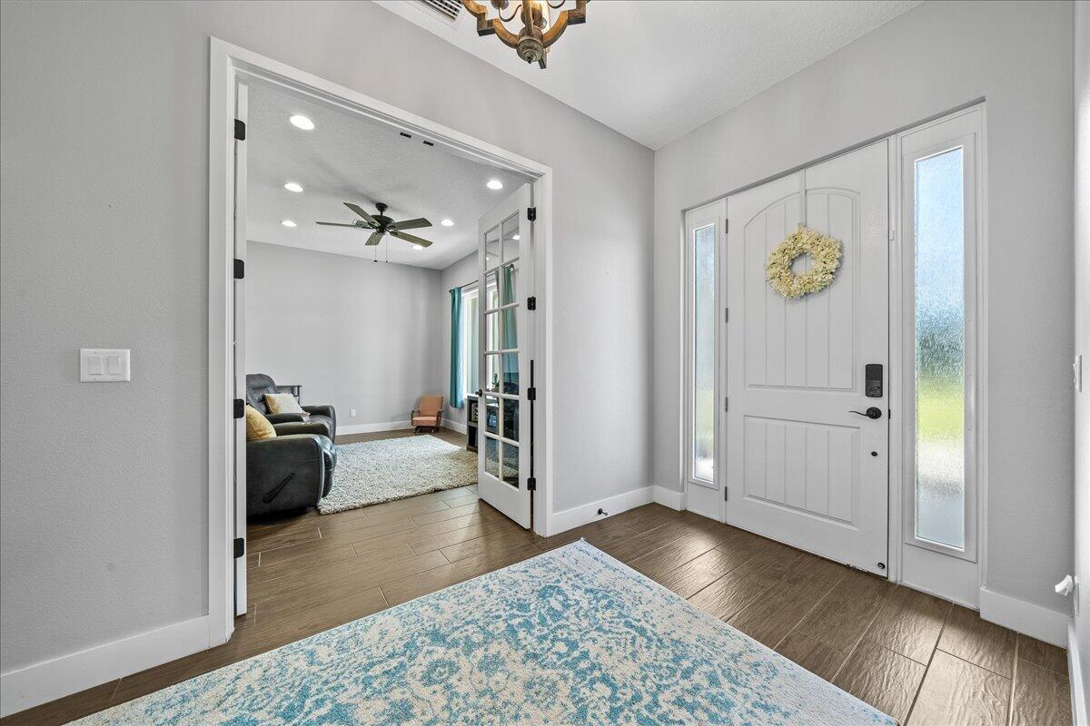 3490 Grant Line Road Mims, FL 32754 - Photo 4 of 43 a view of a livingroom with tub and workspace