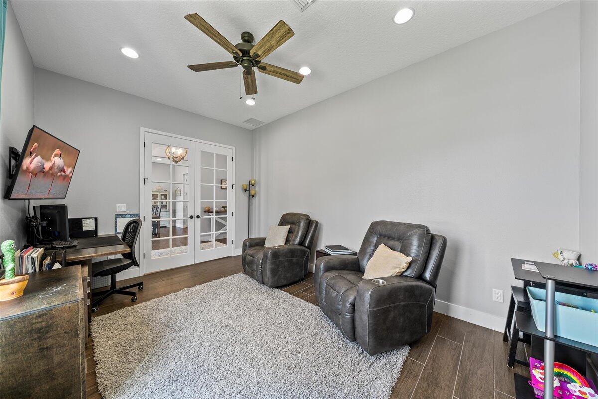 3490 Grant Line Road Mims, FL 32754 - Photo 5 of 43 a living room with furniture a flat screen tv and a large window