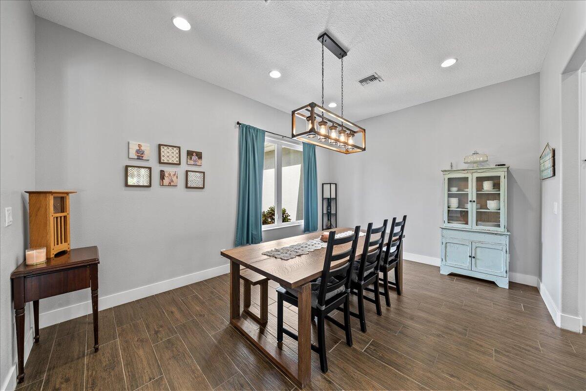 3490 Grant Line Road Mims, FL 32754 - Photo 6 of 43 a view of a dining room with furniture window and wooden floor